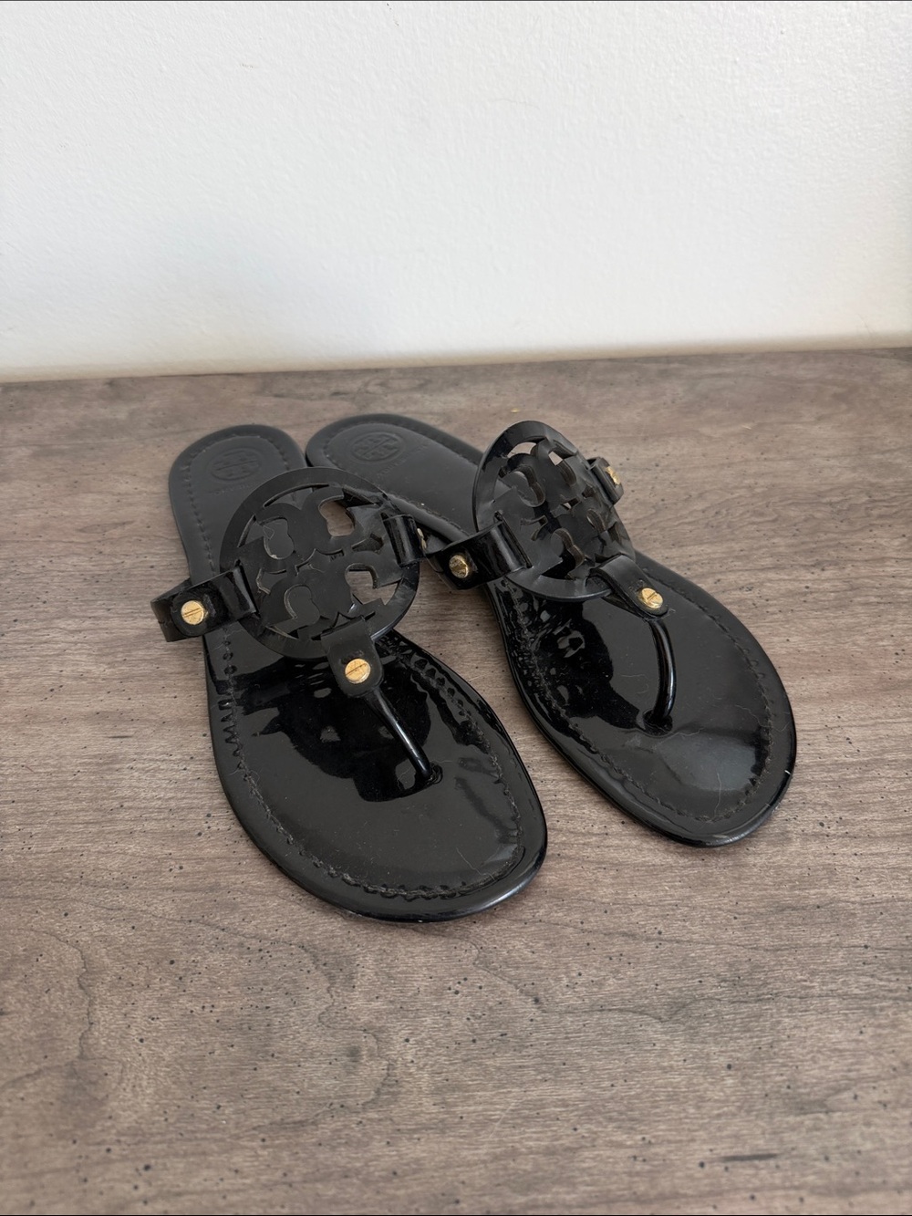 Tory Burch Black Patent Logo Thong Sandals with Gold Accents